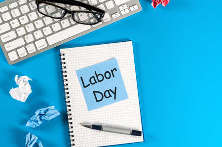 Labor day message on blue work place background labour day celebrated at may 1 spring time