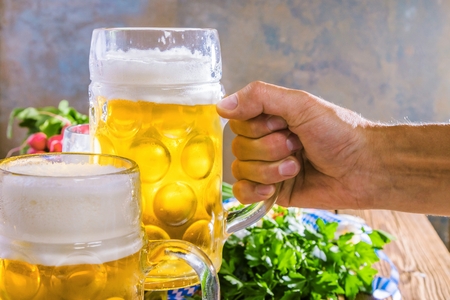 Oktoberfest beer pretzels and various bavarian specialties on wooden background Stock Photo