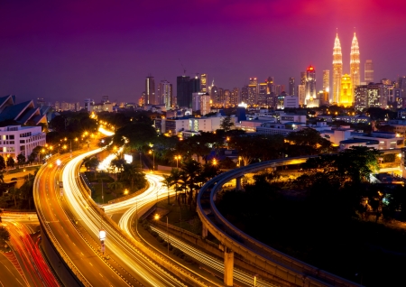 Stunning light trail scenery at the busy highway in kuala lumpur city at night