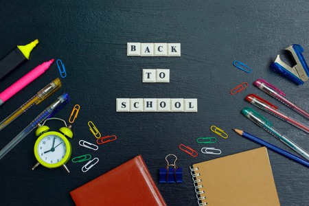 Banner concept back to school on black blackboard background top view flat lay design copy space