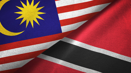 Malaysia and trinidad and tobago two folded flags together