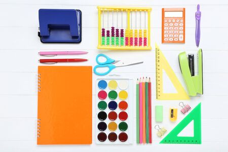 School supplies on white wooden table