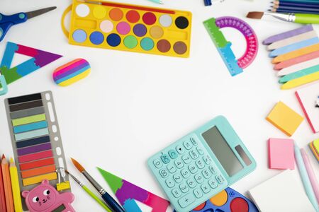 School supplies set of colorful school accessories isolated on the white table