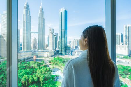 Young asian woman travel around kuala lumpur and looking the city in malaysia