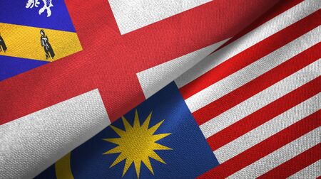 Herm and malaysia flags together textile cloth fabric texture Stock Photo