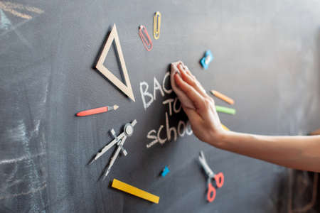 Back to school tools for education on chalkboard background banner hand write with chalk blurred image