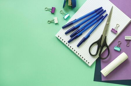 Various office stationery on a mint background Stock Photo