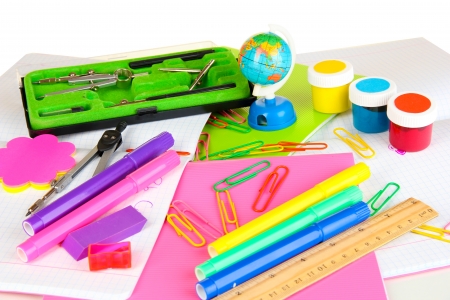 Various school supplies close up isolated on white