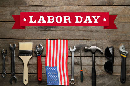 Set of tools and usa flag on wooden background labor day celebration