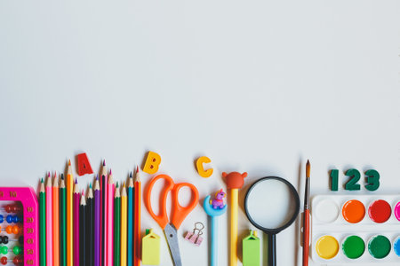 Back to school school supplies on a white background top view copy space