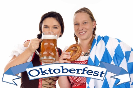 Two young pretty women in dirndl with beer mug