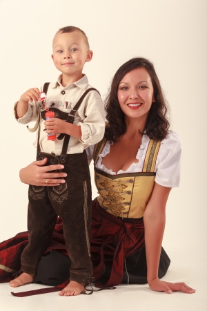 Single mother with her son in bavarian costume