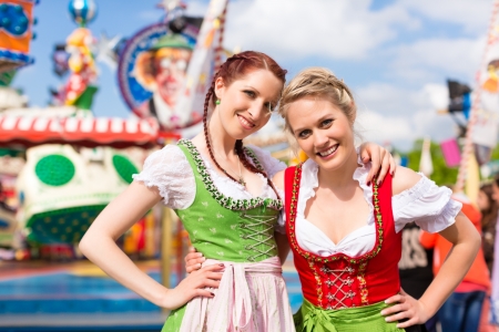 Young women in traditional bavarian clothes dirndl or tracht on a festival or