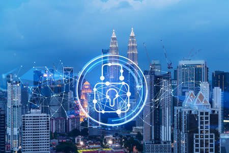 Glowing padlock hologram night panoramic city view of kuala lumpur malaysia asia the concept of cyber security shields to protect kl companies double exposure