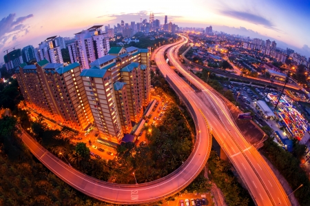 Fisheye lens view of kuala lumpur city skyline during sunset at malaysia asia