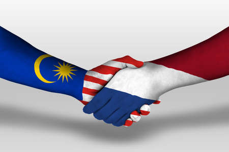 Handshake between netherlands and malaysia flags painted on hands illustration Stock Photo