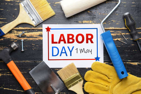 Greeting card for labor day or international workers day with set of tools