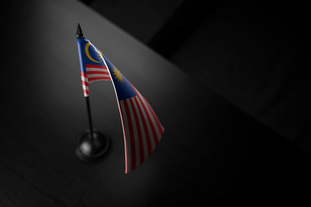 Small national flag of the malaysia on a black background Stock Photo