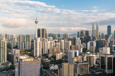 Panoramic view of modern kuala lumpur with menara telecommunication tower and twin towers on cloudy winter day concept of tourism and architecture