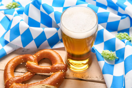 Flag of bavaria mug with beer and pretzel on white wooden background Stock Photo