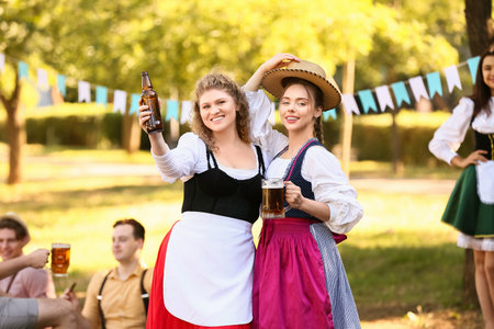 Octoberfest waitresses with beer outdoors