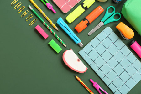 Composition with different stationery on green background Stock Photo