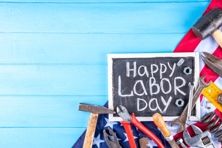 American national patriotic workers happy labor day holiday background construction and manufacturing tools on wooden background with stars red white blue striped us flag