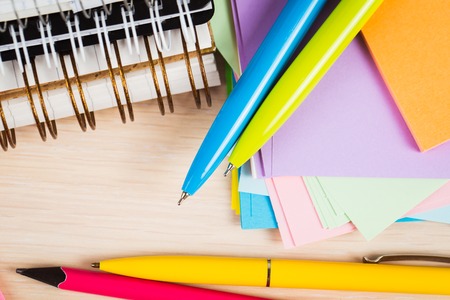 School and office accessories on wooden background