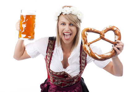 Bavarian woman with beer in traditional costume and bretzel