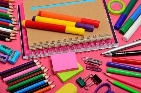 School and office accessories on pink background