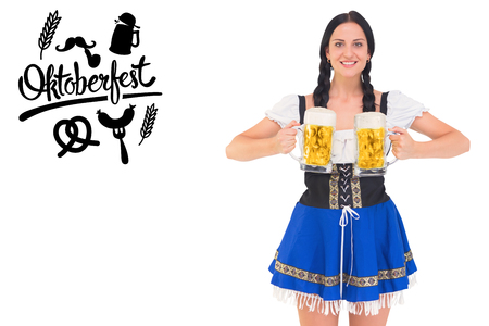 Pretty oktoberfest girl holding beer tankards against oktoberfest graphics