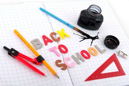 Old fashioned back to school with ink pot and pencil