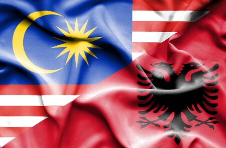 Waving flag of albania and malaysia