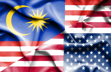 Waving flag of united states of america and malaysia Stock Photo