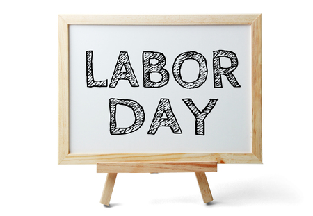 Small whiteboard with text labor day is isolated on white background Stock Photo