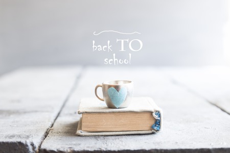 Back to school book text and mug with heart