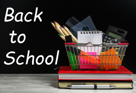 Back to school concept with many school supplies in a shopping cart Stock Photo