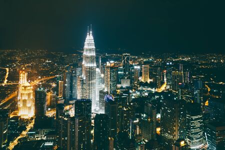 Vintage tone of kuala lumpur city skyline by night kuala lumpur malaysia