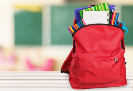 Schoolbag with supplies for education Stock Photo